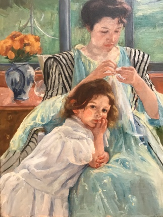A kiddo tries to interrupt her mother in "Young Mother Sewing" by Mary Cassatt